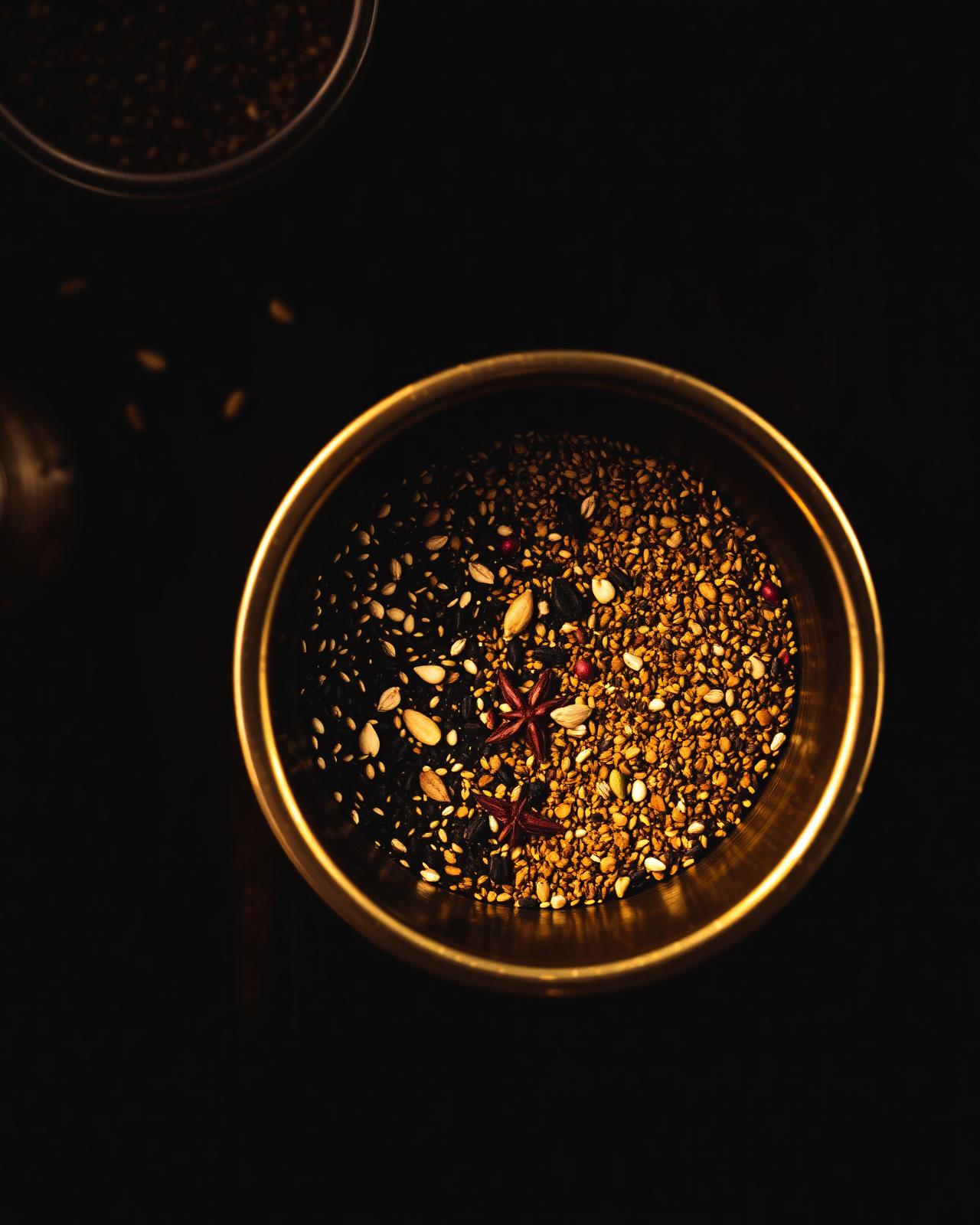 Bengali panch phoron five-spice blend in a brass bowl, top-down